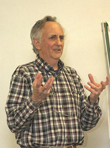 Photo by Aaric Bryan Chuck Sperry, a facilitator from the National Forest Foundation, speaks to a group of about 25 people about the Cedar-Thom project at the Superior Ranger station Wednesday.