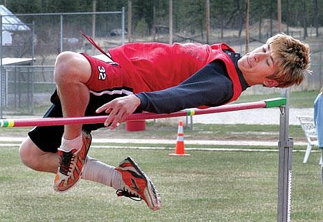 Photo by Adam Herrenbruck Drew Payne floats in the air during the high jump competition. The Savage Heat eighth-grader cleared 5 feet, 6 inches to take first among A-Boys. The mark was also a personal record for Payne.