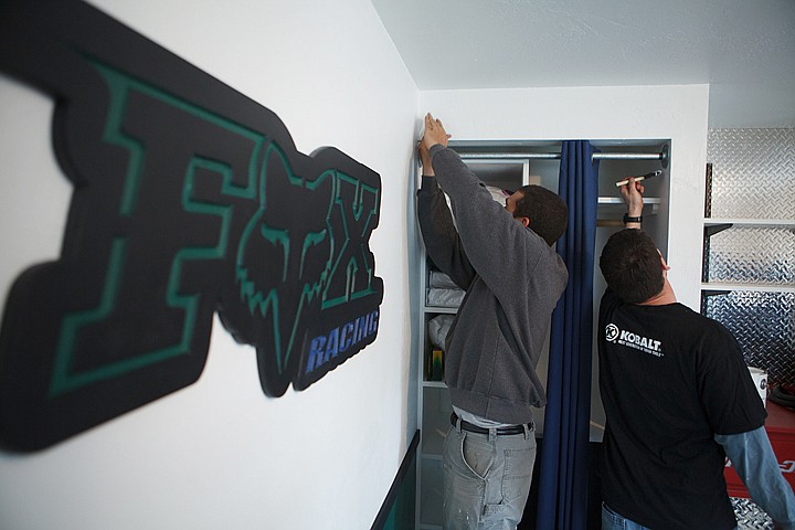 &lt;p&gt;Glacier High School assistant principal Micah Hill, right, and shop teacher Andy Fors, put the finishing touches on Caleb Speed's bedroom Saturday afternoon in Evergreen. Glacier staff and students, along with Special Spaces, have been working on Caleb's room since early February.&lt;/p&gt;