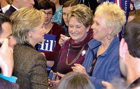 Photo by Jennifer Morgan Plains resident Susan Schroedel (far right) shakes the hand of New York Senator Hillary Clinton, candidate for president, at a speech in Missoula.