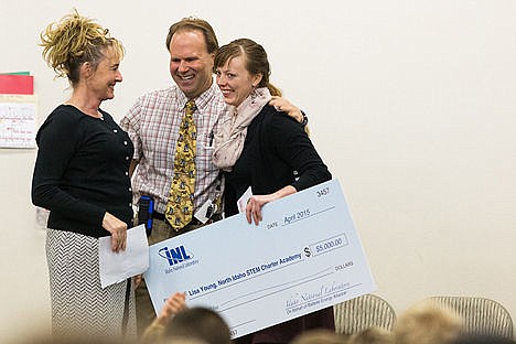 &lt;p&gt;Lisa Young, a fourth-grade student at North Idaho STEM Charter Academy, far right, celebrates with co-founder and principal Scott Thomson and Anne Seifert, K-12 education and STEM outreach coordinator for the Idaho National Laboratory, after being presented with a $5,000 grant, that will be used in a classroom makeover, during an assembly Wednesday at the Rathdrum school.&lt;/p&gt;