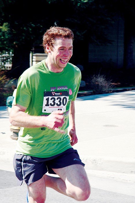 <p>Bryan Tevis of Coeur d&Otilde;Alene charges along the course, about a quarter mile from the finish line of the Spring Dash. He completed the 5-mile race in 26:08.</p>
