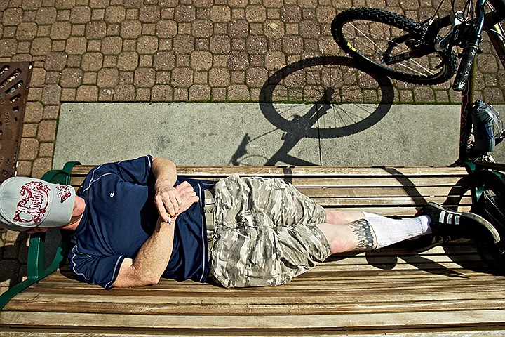 &lt;p&gt;JEROME A. POLLOS/Press Mike Curry II soaks in the sun while resting on a bench Tuesday in downtown Coeur d'Alene.&lt;/p&gt;