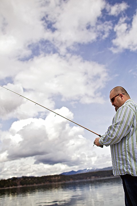 &lt;p&gt;JEROME A. POLLOS/Press Joseph Cool reels in his lure while fishing from the Honeysuckle Beach dock on his lunch break Thursday in Hayden.&lt;/p&gt;