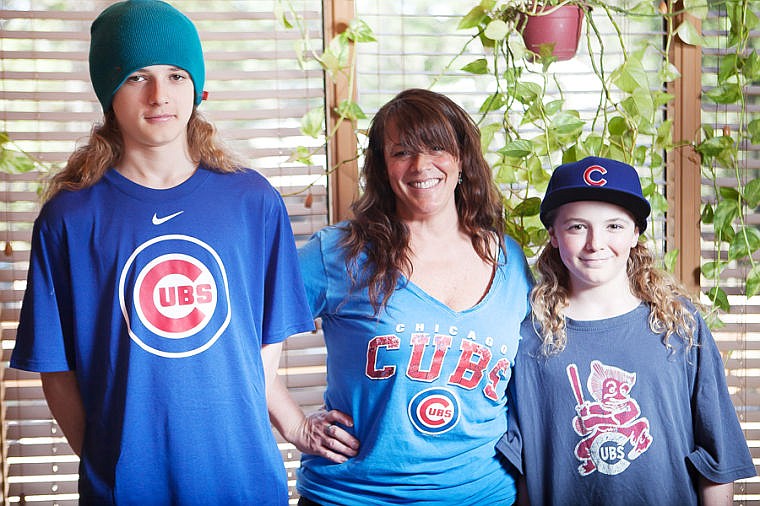 <p>Lesley Quigg and her sons Carl, right, and Reid are descendants of the first owner of Wrigley Field in Chicago. April 19, 2014 in Whitefish, Montana. (Patrick Cote/Daily Inter Lake)</p>