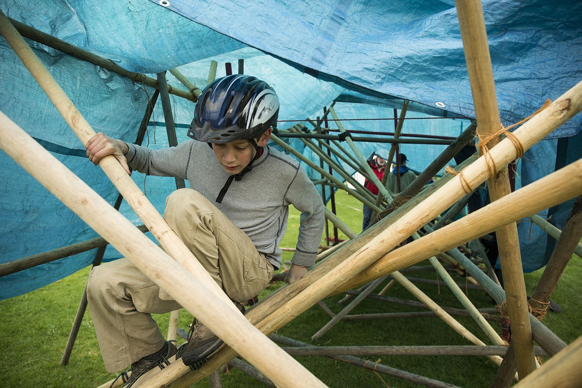 &lt;p&gt;Kanyon Fitzsimmons, 12, from Boy Scout Troop 290, makes his way through a maze built by Troop 3 of Coeur d'Alene, Idaho during the Scout O'Rama held at the Kootenai County Fairgrounds on Saturday.&lt;/p&gt;