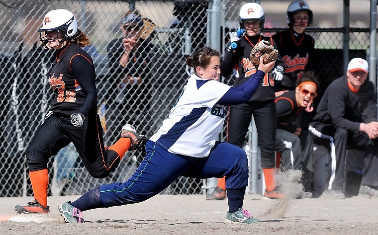 Flathead&#146;s Karlee Stacy runs over first base after Glacier&#146;s Abby Connolly makes the catch to force her out in the sixth inning during the first game of Friday afternoon&#146;s crosstown softball doubleheader at Kidsports Complex.