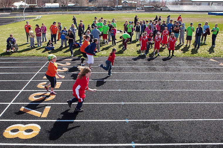&lt;p&gt;Spectators cheer as competitors take off in the 100-meter run Friday morning during the Special Olympics Montana Area Games at Legends Stadium in Kalispell. Nearly 200 athletes competed in the games, featuring track, power lifting, swimming, bocce and bowling.&lt;/p&gt;
