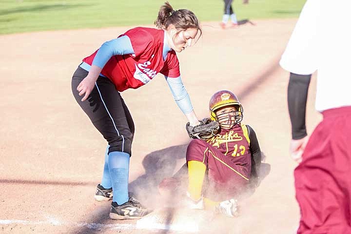 Vanessa Weaver beats the tag as she slides into third base.