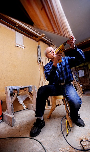 Greg Morley works on building a canoe in his shop on Wednesday, April 14.