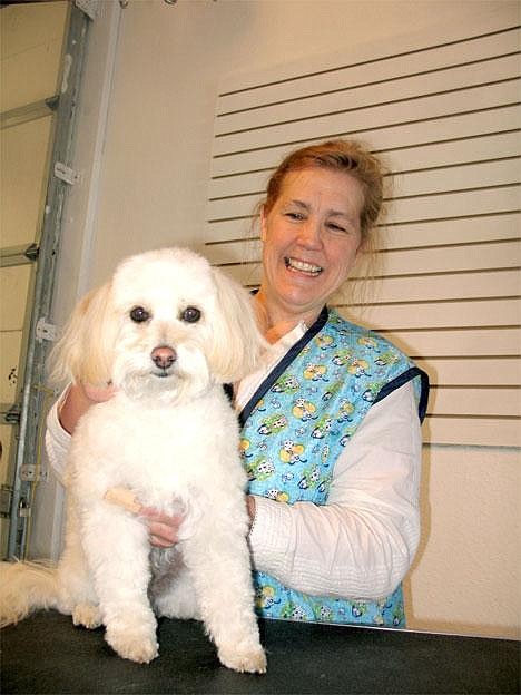 Bark Avenue owner Collette Taylor shows off Bentley, one of her clients, in the Moses Lake location of her expanding Grant County business the afternoon of April 14. Photo by Matthew Weaver/Columbia Basin Herald