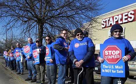 &lt;p&gt;Postal workers picket in front of a Staples store Thursday in Concord, N.H. Postal workers around the country protested in front of Staples stores, objecting to the U.S. Postal Service's pilot program to open counters in stores, staffed with retail employees.&lt;/p&gt;