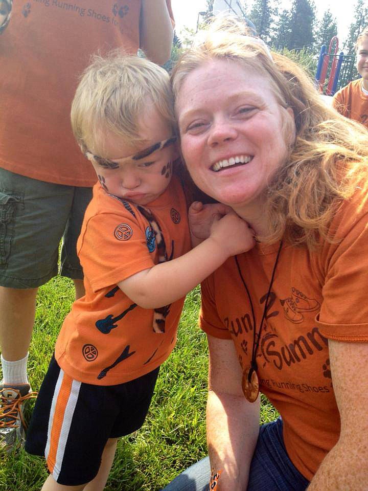 <p>Colene Hotmer and her son Andy at the Harvest Run last year put on by Running Shoes 4 Kids.</p>