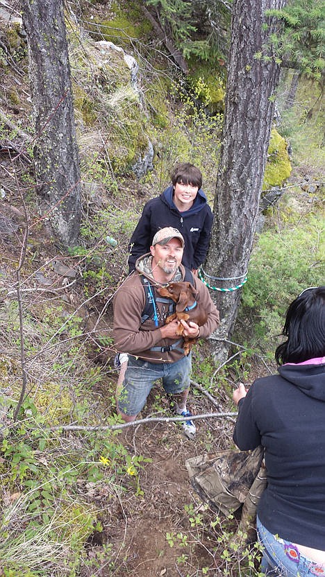 &lt;p&gt;Rob Reed of Spirit Lake holds Daisy, Tom McTevia&#146;s dog that was found Saturday near the site where McTevia died when his ATV rolled off a cliff. Reed&#146;s son, Logan, 15, looks on.&lt;/p&gt;