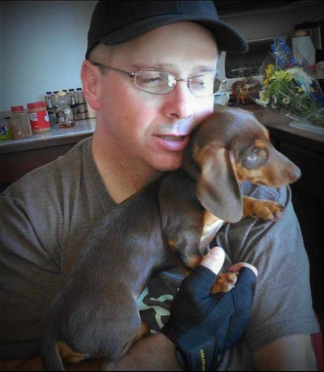 &lt;p&gt;Tom McTevia holds his dog, Daisy. McTevia died a week ago when his ATV rolled off a steep cliff in Bonner County. The dog was with him at the time and was found uninjured Saturday, six days after the crash.&lt;/p&gt;