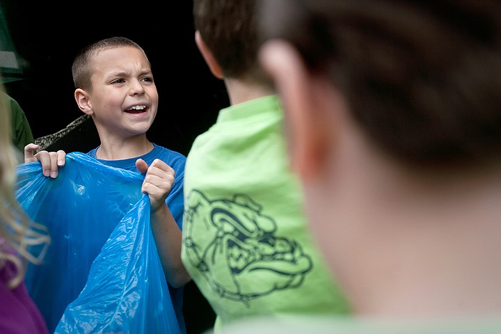 &lt;p&gt;JULIA MOORE/Press Javin Johnson, a fourth-grader, holds a bag of recyclables in preparation to put them in a Waste Management truck Thursday morning at Borah Elementary School in Coeur d'Alene. Grades kindergarden through fifth collected plastic bottles, aluminum cans, and cardboard this week to emphasize the importance of recycling. In a total of four days, the school collected 10,387 recyclables.&lt;/p&gt;