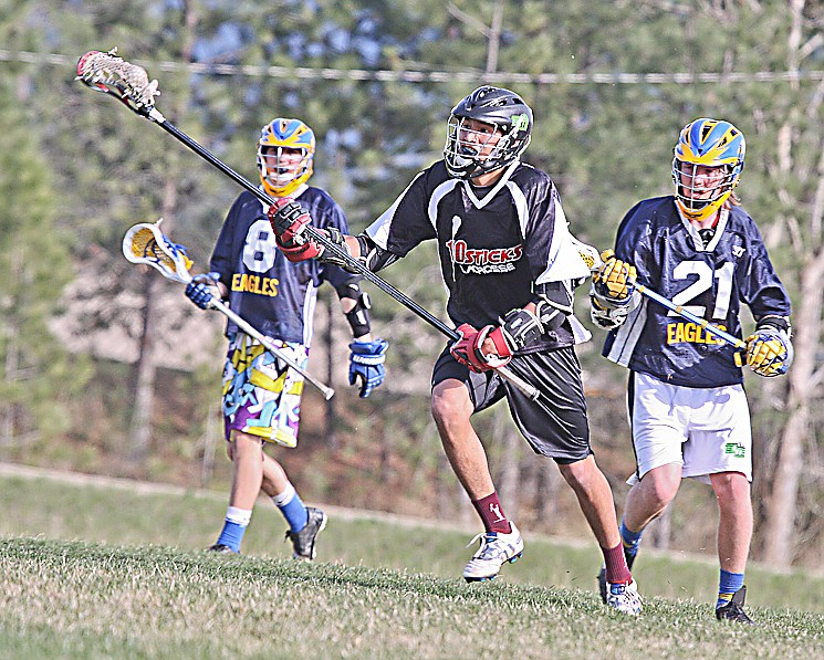 &lt;p&gt;Al Plant rushes the ball up field during the 10Sticks lacrosse game on Thursday against Big Sky.&lt;/p&gt;