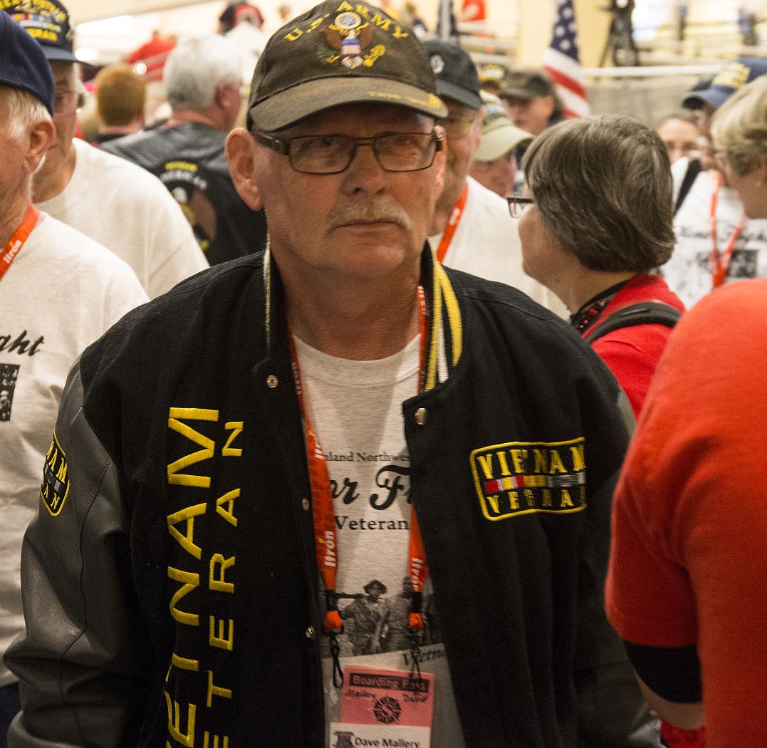 &lt;p&gt;Vietnam War veteran Dave Mallery, of Post Falls, Idaho makes his way down the Honor Flight welcome parade route on Tuesday at the Spokane International Airport.&lt;/p&gt;