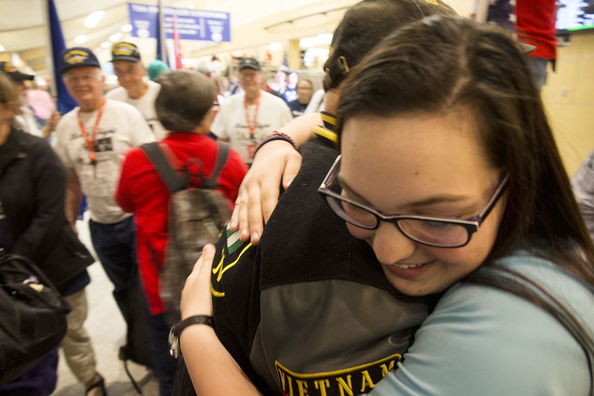 &lt;p&gt;Kendall Cone, right, a Post Falls High sophomore, hugs her grandfather Dave Mallery as he returns home from visiting the war memorials in Washington, D.C. on Tuesday night at Spokane International Airport.&lt;/p&gt;