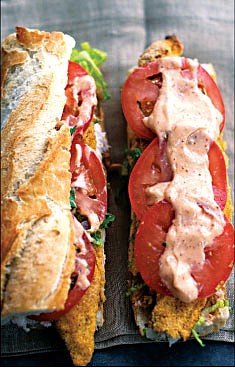 <p>This photo shows baked catfish po'boys with Cajun remoulade sauce.</p>