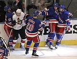 Devils, Rangers advance in 7