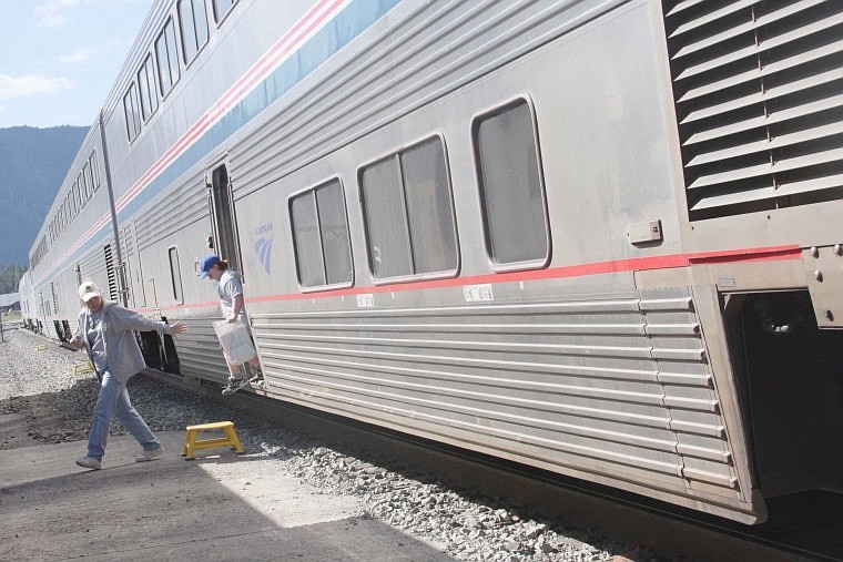 Raelyn Cox and son Presley step off of an Amtrak train after taking a tour and hearing train safety tips on Friday.