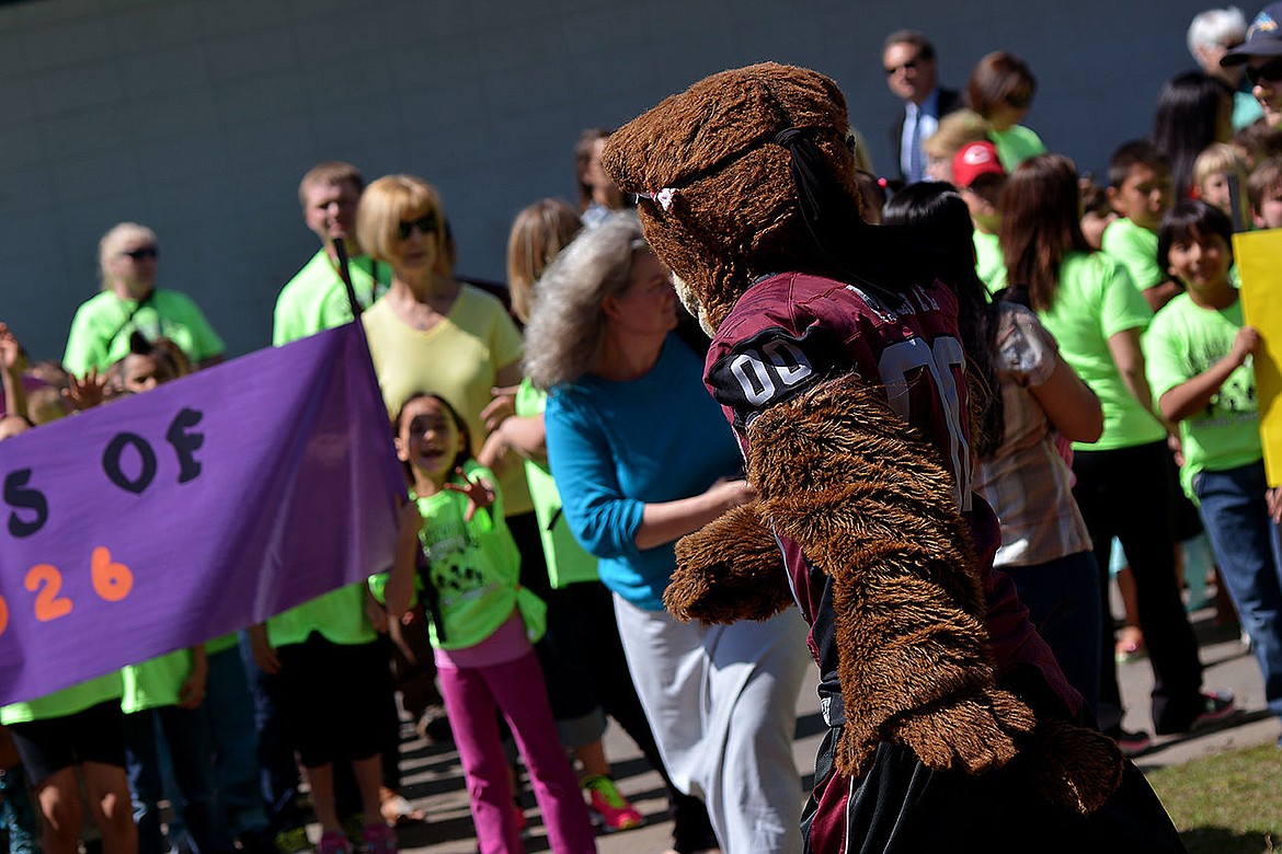 &lt;p&gt;A Pablo Elementary second-grade student reaches out and shouts for Monte, trying to capture his attention for a high-five.&lt;/p&gt;