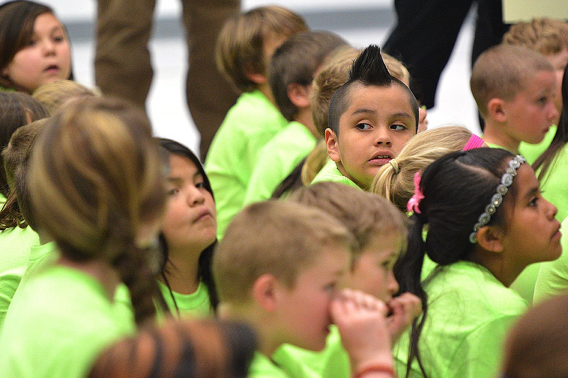 &lt;p&gt;Elliott Natz Lake County Leader Dennis Juneau, 7, sits with his second-grade class just before Governor Bullock and Denise Juneau speak to the school.&lt;/p&gt;