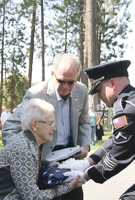 &lt;p&gt;Gladys Schneidmiller is presented a flag from Post Falls Police Officer Troy Moss during a veterans' memorial ceremony in 2012 at Evergreen Cemetery in Post Falls as Schneidmiller's son Gary assists. Gladys Schneidmiller, who served with the Post Falls School Board, Idaho Parent-Teacher Association, Idaho Community Foundation, Royal Neighbors of America and Kootenai Medical Center Foundation, died on Sunday night at 97.&lt;/p&gt;