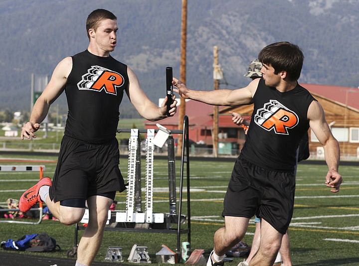 &lt;p&gt;Kasey Mock hands off to Collin McGuyer during the Ronan relay event Thursday event.&lt;/p&gt;