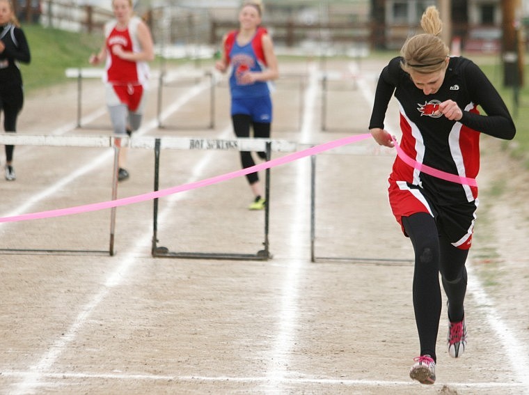 Devon White wins the 300 m hurdles at Hot Springs.