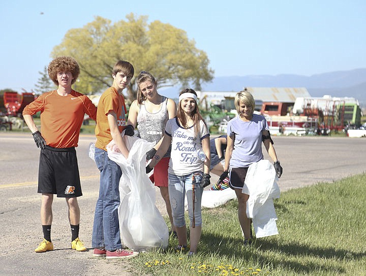 &lt;p&gt;Some of Ronan's long distance runners pose along Highway 93 during their clean up day Wednesday.&lt;/p&gt;