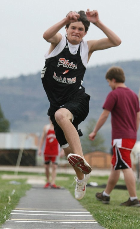 Dustin Baker soars in the triple jump at Hot Springs.