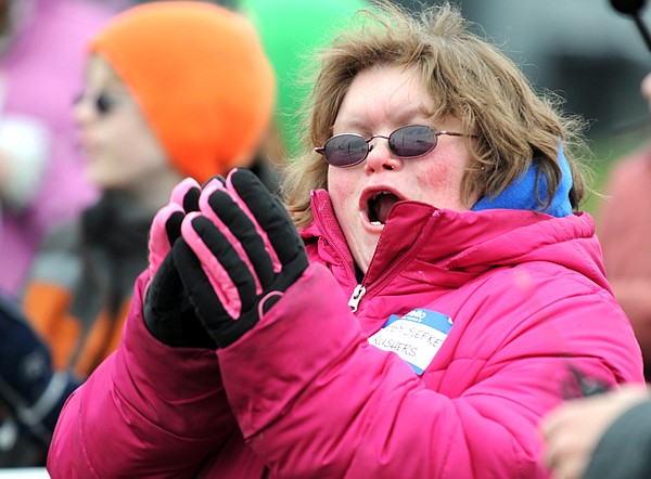 Chrissy Siefke of the Krushing Boundaries team cheers at the start of the Special Olympics.