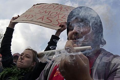 &lt;p&gt;A man lights a large marijuana joint in Amsterdam on April 20 during a protest against a government plan to stop foreigners from buying marijuana in the Netherlands.&lt;/p&gt;