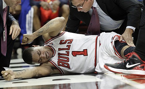 &lt;p&gt;Bulls guard Derrick Rose grimaces in pain after suffering a season-ending ACL tear during the fourth quarter Saturday. Chicago defeated the visiting Philadelphia 76ers 103-91 in Game 1 of their Eastern Conference quarterfinals series.&lt;/p&gt;