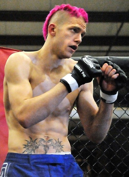 Kalispell's Gus Nolte puts up his dukes before starting his fight against Plains' Anthony Young.