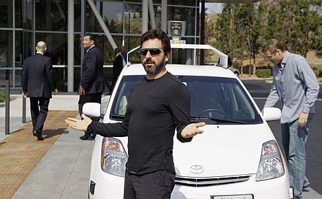 &lt;p&gt;Google co-founder Sergey Brin gestures after riding in a driverless car with officials, to a bill signing for driverless cars at Google headquarters in Mountain View, Calif., Sept. 25, 2012.&lt;/p&gt;