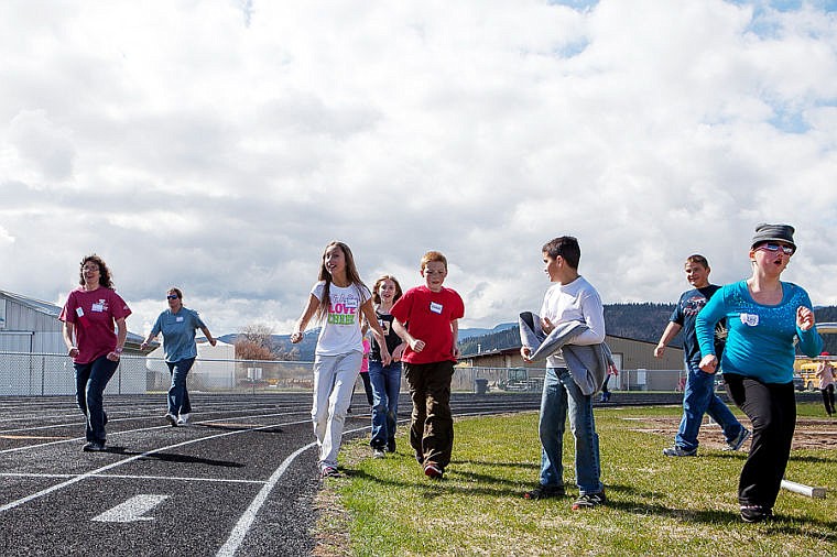 &lt;p&gt;Fifth-grade students from Swan River School run along the track cheering on competitors in the 400-meter walk Friday morning during the Special Olympics Montana Area Games at Legends Stadium. April 25, 2014 in Kalispell, Montana. (Patrick Cote/Daily Inter Lake)&lt;/p&gt;