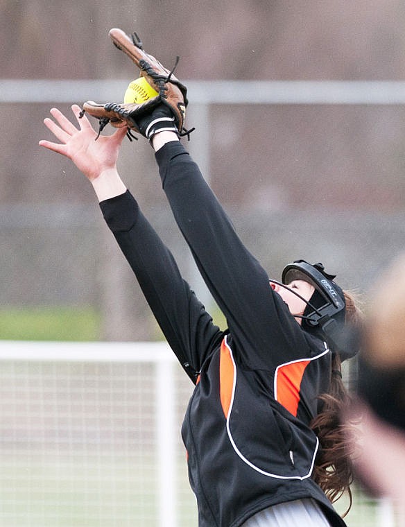 &lt;p&gt;Flathead shortstop Abbie O'Brien stretches to make a catch Thursday afternoon during Glacier's win in the first game of a doubleheader against Flathead at Conrad Complex. April 24, 2014 in Kalispell, Montana. (Patrick Cote/Daily Inter Lake)&lt;/p&gt;