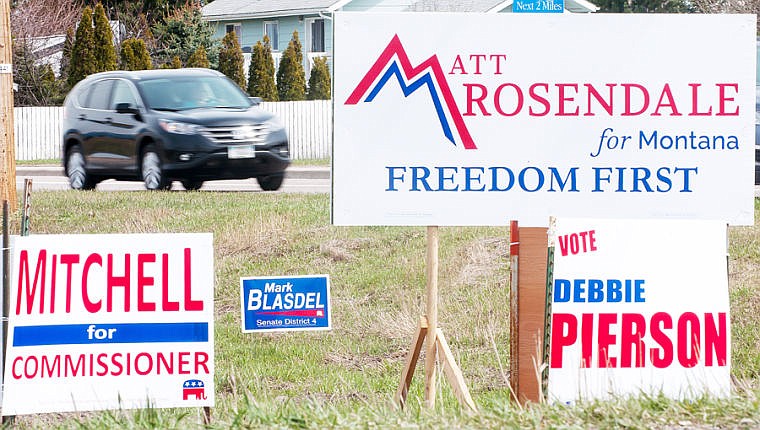 &lt;p&gt;Vehicles drive past campaign signs posted along the north side of Reserve Drive near Whitefish Stage Road at the edge of Kalispell.&lt;/p&gt;