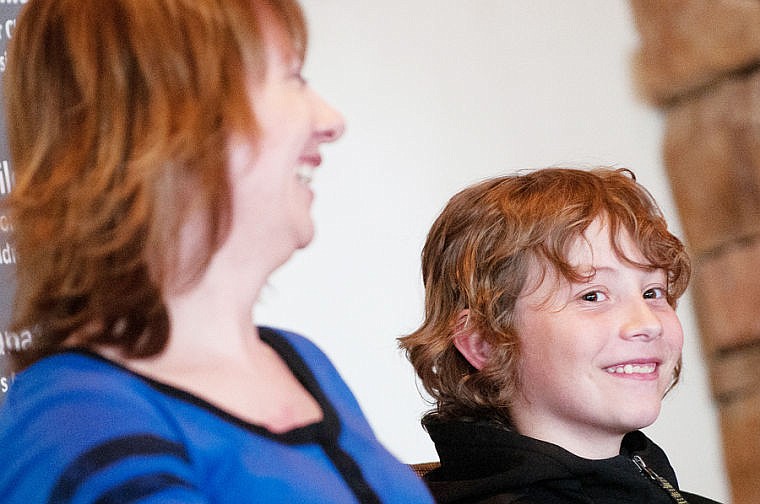 &lt;p&gt;Jason Albin of Columbia Falls smiles while sitting next to his mother Michelle during a presentation naming Jason the 2104 Children's Miracle Network Hospitals Champion for the state of Montana on Thursday afternoon at the Bad Rock Volunteer Fire Department. Albin has phenylketornuria, a condition that prevents his body from being able to break down certain proteins. April 17, 2014 in Columbia Falls, Montana. (Patrick Cote/Daily Inter Lake)&lt;/p&gt;