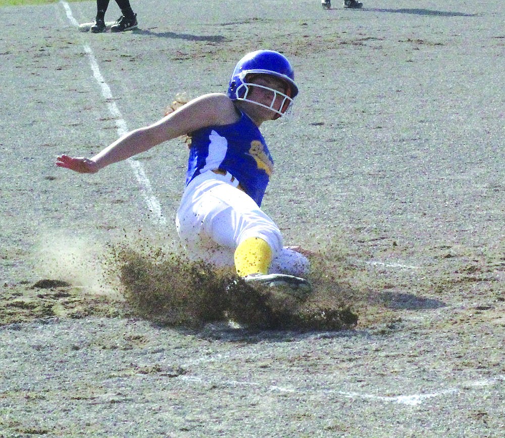 &lt;p&gt;Freshman Shelby Hooten of Thompson Falls slides into home plate during the Lady Hawks victory over Plains last week.&lt;/p&gt;