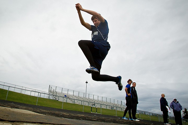 &lt;p&gt;Lake City High's Dylan Martz flies toward the sand pit to a distance of 38-feet 3-inches during the triple-jump competition.&lt;/p&gt;