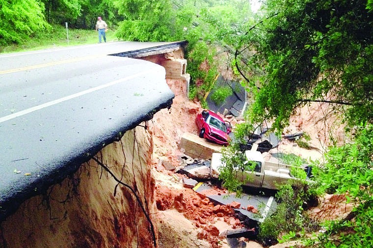 &lt;p&gt;Vehicles rest at the bottom of a ravine after the Scenic Highway collapsed near Pensacola, Fla., Wednesday April 30, 2014. Heavy rains and flooding have left people stranded in houses and cars in the Florida Panhandle and along the Alabama coast. According to the National Weather Service, an estimated 15-20 inches of rain has fallen in Pensacola in the past 24 hours.&lt;/p&gt;