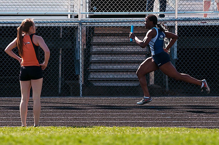 &lt;p&gt;A Flathead athlete watches as Glacier's Shauna Williams (right) leads the last leg of the 400-meter White Tuesday afternoon during the crosstown track meet at Legends Stadium. April 29, 2014 in Kalispell, Montana. (Patrick Cote/Daily Inter Lake)&lt;/p&gt;