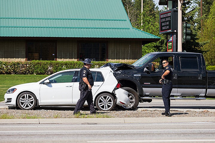 &lt;p&gt;A trooper with the Idaho State Police and an officer with the Coeur d&#146;Alene Police Department work the scene of an accident near the intersection of U.S. 85 and Canfield Avenue on Wednesday in Coeur d&#146;Alene. According to the Idaho State Police, the driver, Melinda Duncan, 52, of a Volkswagon Golf was stopped at a red light when the driver of the pickup, Edward Castleton, 54, rear-ended the compact vehicle. Both drivers were transported to Kootenai Health. An investigation into the accident is currently under way.&lt;/p&gt;