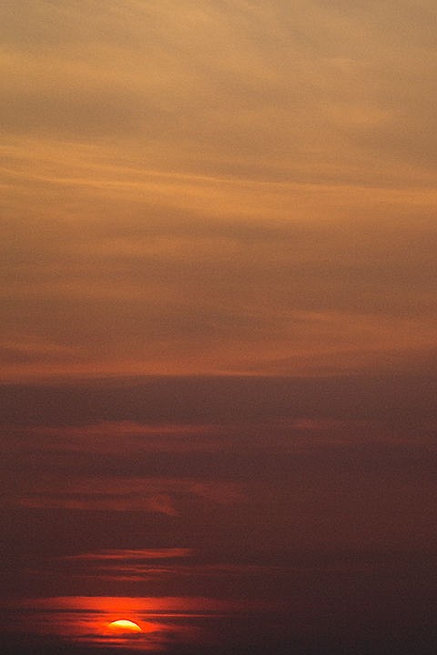 &lt;p&gt;The sun sets beneath a deep red cloud cover on Tuesday evening over the Rathdrum Prairie.&lt;/p&gt;