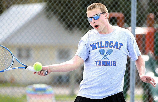 Parker Johnson, a sophomore at Columbia Falls, plays in the boys singles against Ronan on Monday.