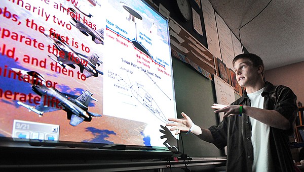 Branden Perina of Whitefish, an eighth grader at Olney-Bissell School presents his science fair project &quot;Wing Functions, Airfoil Design, Lift, and Everything in Between&quot; on Tuesday. &quot;I found my new passion with this,&quot; said Perina. &quot;I love this stuff!&quot;